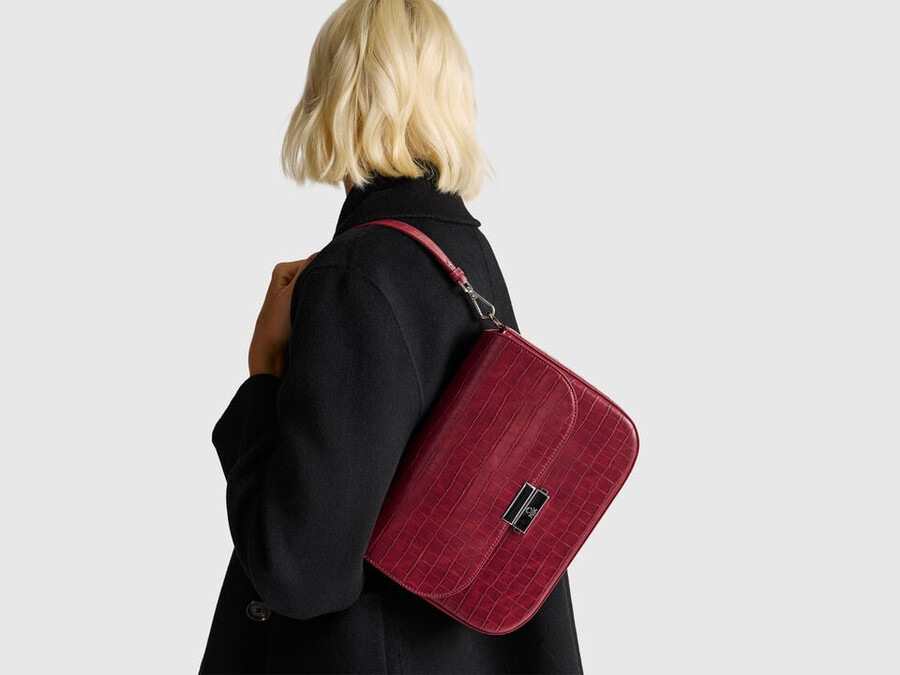 large red be bag with coconut print