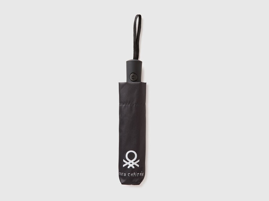black umbrella with coco capitán text
