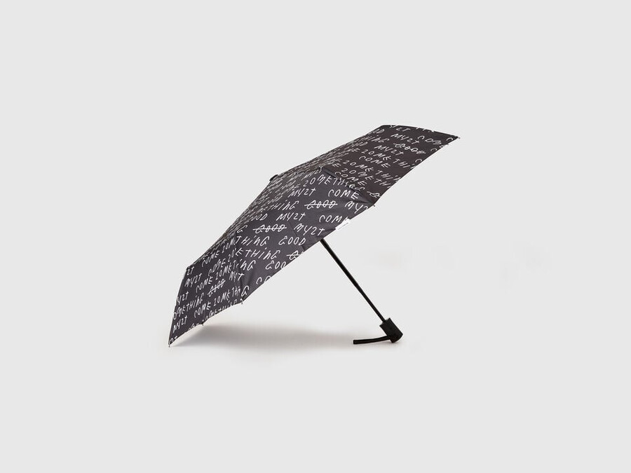 black umbrella with coco capitán text
