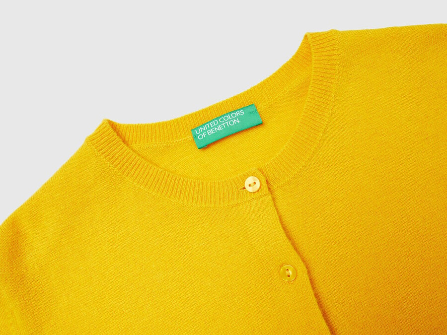 ocher yellow crew neck cardigan in pure merino wool